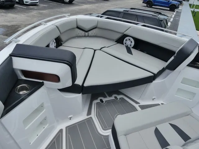 Slide: The Image of The image shows the bow area of a Monterey Elite 30 OB boat with gray and black upholstery. - 15