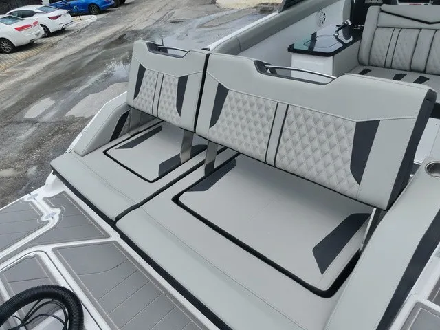 Slide: The Image of The 2027 Monterey Elite 30 OB features stylish gray upholstery with black accents and modern patterns. - 7