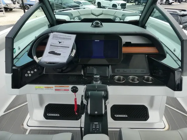 Slide: The Image of The cockpit of the Monterey Elite 30 OB features a modern dashboard with steering wheel and touchscreen. - 11