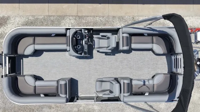 Slide: The Image of Aerial view of a modern pontoon boat with gray and black seating, a helm, and a sunshade. - 9