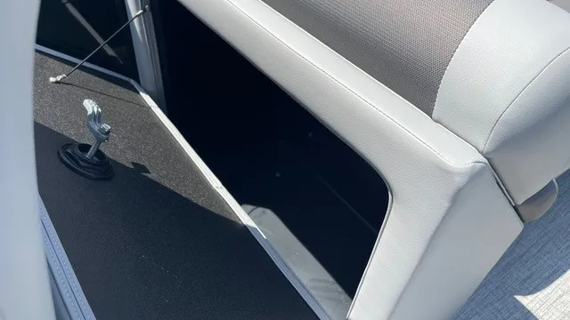 Slide: The Image of Close-up of a seating area with gray upholstery and storage space underneath. - 13