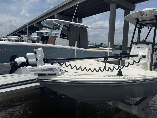 Slide: The Image of A modern Pathfinder 2500 Hybrid docked under a bridge, equipped with a Minn Kota motor. - 15