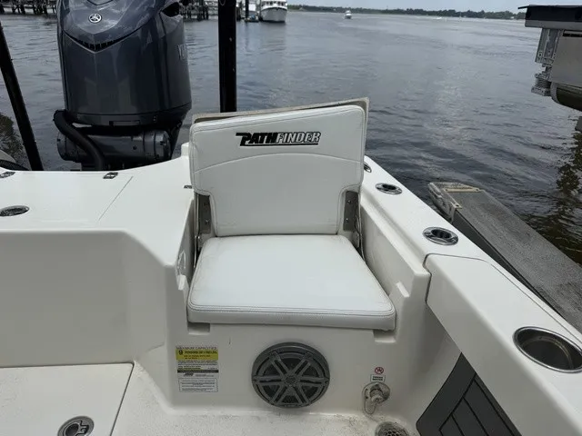 Slide: The Image of A white seat on a Pathfinder 2500 Hybrid boat, with a speaker below it. - 10