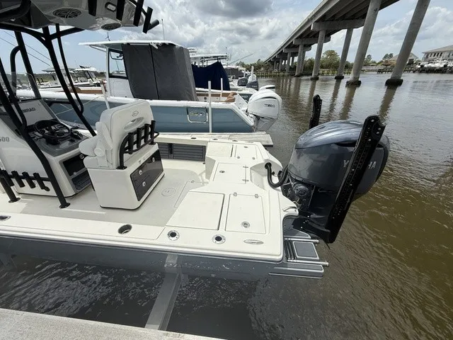 Slide: The Image of A 2025 Pathfinder 2500 Hybrid docked. The outboard motor is visible. - 16