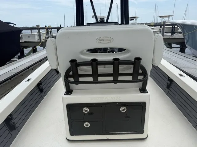 Slide: The Image of The image shows the cockpit of a Pathfinder 2500 Hybrid boat with rod holders and storage. - 14