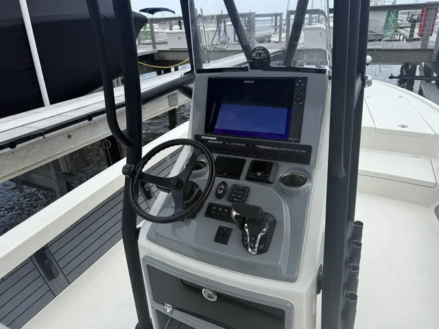 Slide: The Image of The image shows the helm of a 2025 Pathfinder 2500 Hybrid with a modern navigation system. - 11