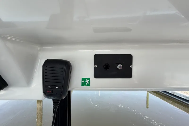 Slide: The Image of Interior view of 2020 Jeanneau NC Sport 895 boat with communication device and control panel. - 66