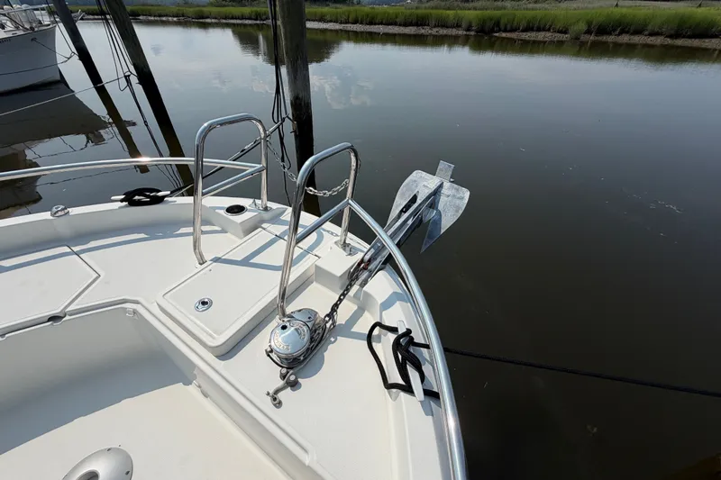 Slide: The Image of Bow of 2020 Jeanneau NC Sport 895 boat with anchor and railing in calm water. - 42