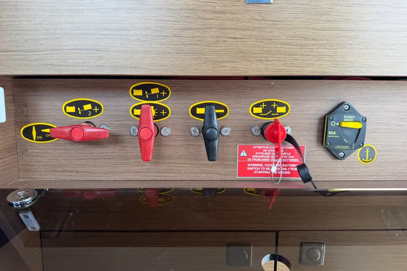 Slide: The Image of Control panel of a 2020 Jeanneau NC Sport 895 boat with battery switches and labels. - 50