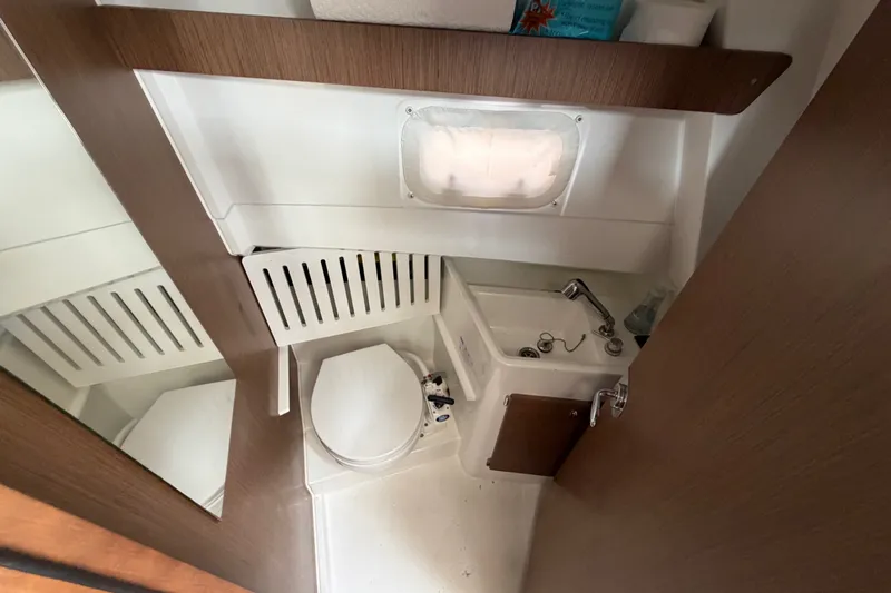 Slide: The Image of Compact bathroom in 2020 Jeanneau NC Sport 895 boat with sink and toilet. - 30
