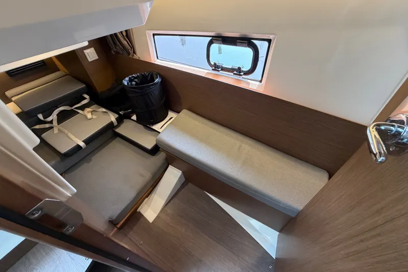 Slide: The Image of Interior cabin of 2020 Jeanneau NC Sport 895 boat with seating and window. - 34
