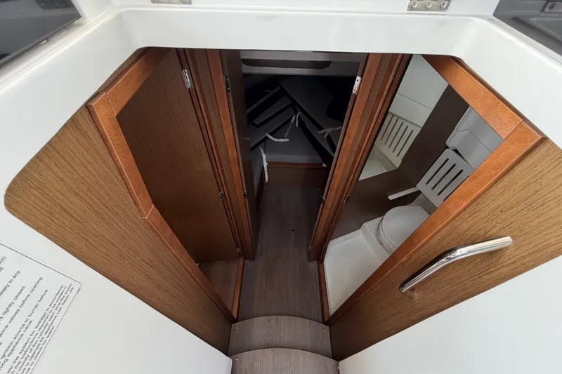 Slide: The Image of Interior view of 2020 Jeanneau NC Sport 895 cabin with wooden finish and compact design. - 29
