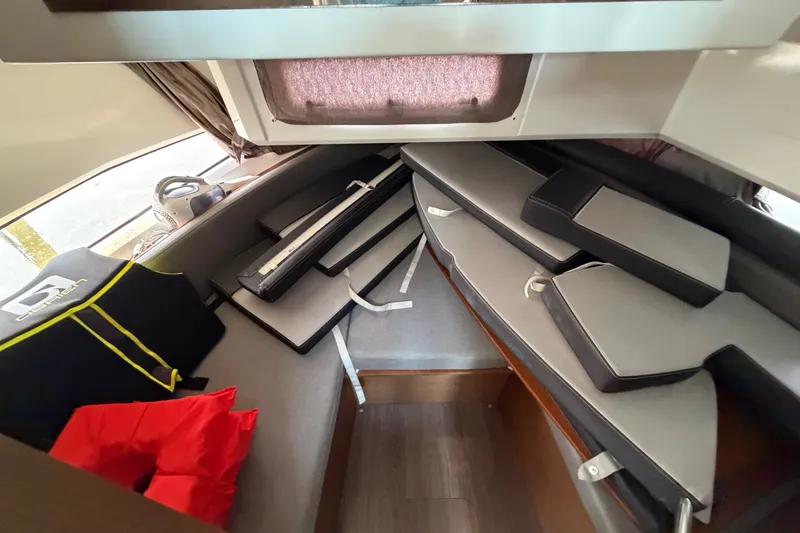 Slide: The Image of Interior cabin of 2020 Jeanneau NC Sport 895 with cushions and life jackets. - 31