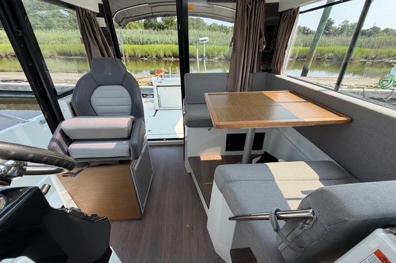 Slide: The Image of Interior of 2020 Jeanneau NC Sport 895 boat with seating and table. - 37