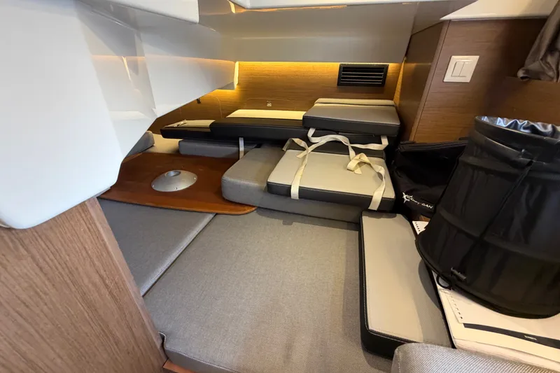 Slide: The Image of Interior cabin of 2020 Jeanneau NC Sport 895 with cushions and storage. - 35