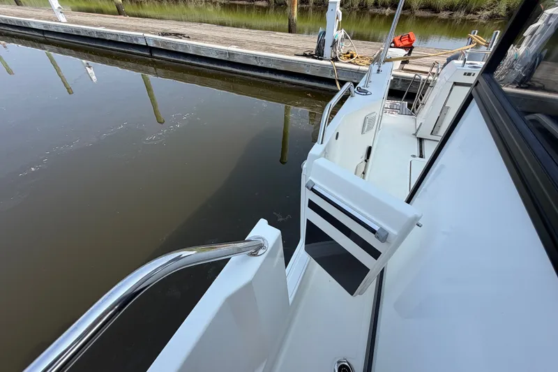 Slide: The Image of 2020 Jeanneau NC Sport 895 docked, showcasing sleek design and modern features. - 47
