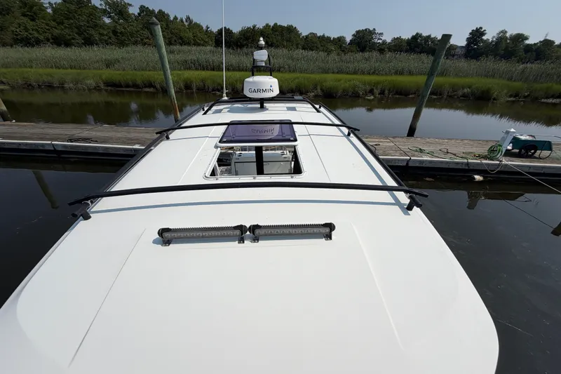 Slide: The Image of 2020 Jeanneau NC Sport 895 boat docked, featuring Garmin equipment and sleek design. - 44