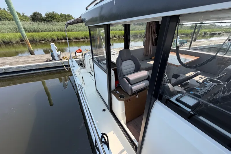 Slide: The Image of 2020 Jeanneau NC Sport 895 docked, showcasing sleek design and modern interior. - 40
