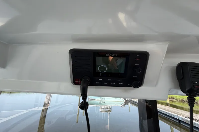 Slide: The Image of Garmin marine radio on 2020 Jeanneau NC Sport 895 boat dashboard. - 65