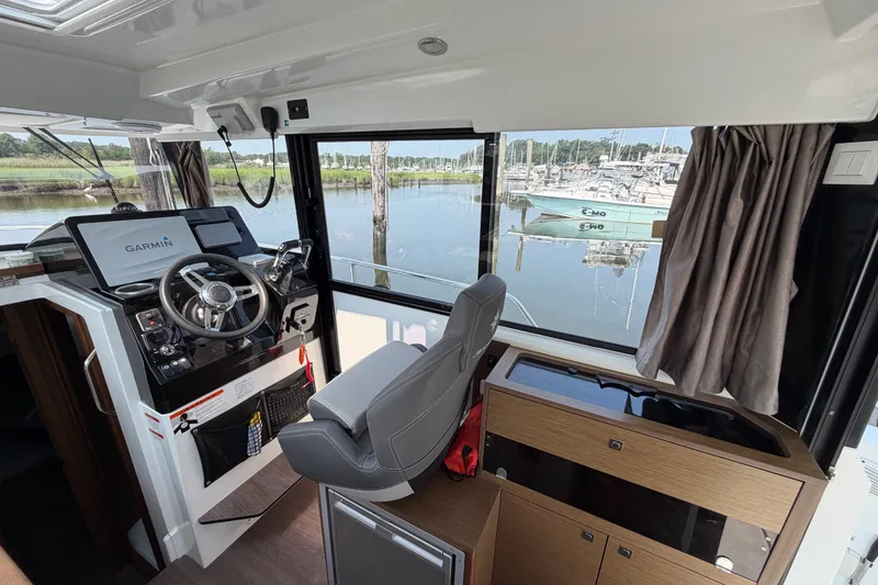Slide: The Image of Interior of 2020 Jeanneau NC Sport 895 boat with Garmin navigation system. - 18
