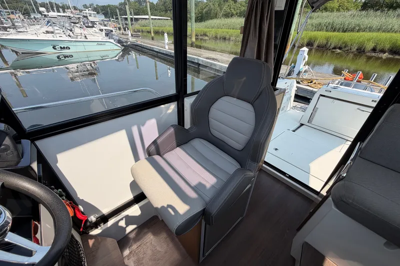 Slide: The Image of Interior of 2020 Jeanneau NC Sport 895 boat with a comfortable captain's chair. - 25