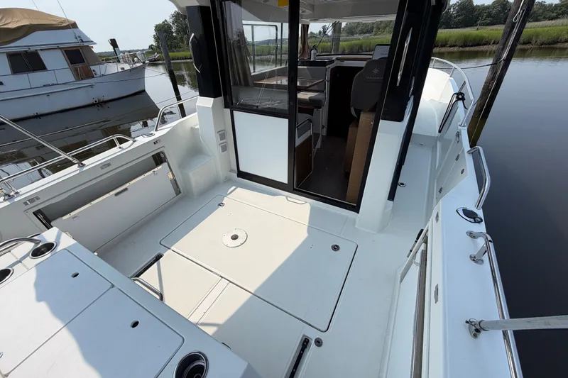 Slide: The Image of 2020 Jeanneau NC Sport 895 boat interior with open cockpit and sleek design. - 11