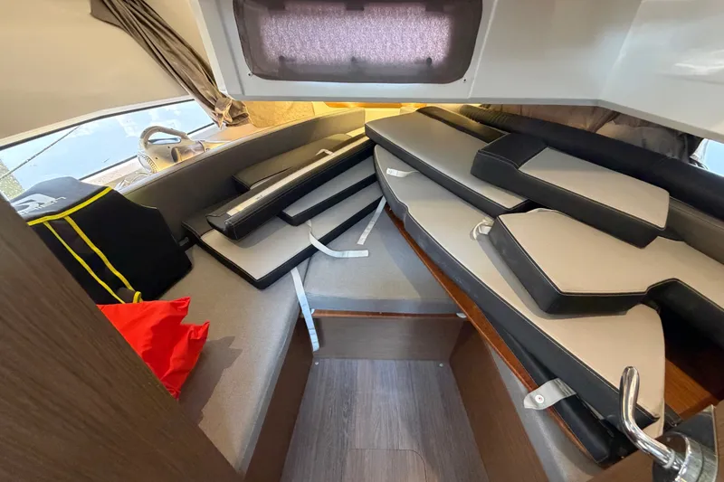 Slide: The Image of Interior cabin of 2020 Jeanneau NC Sport 895 with cushions and storage. - 33