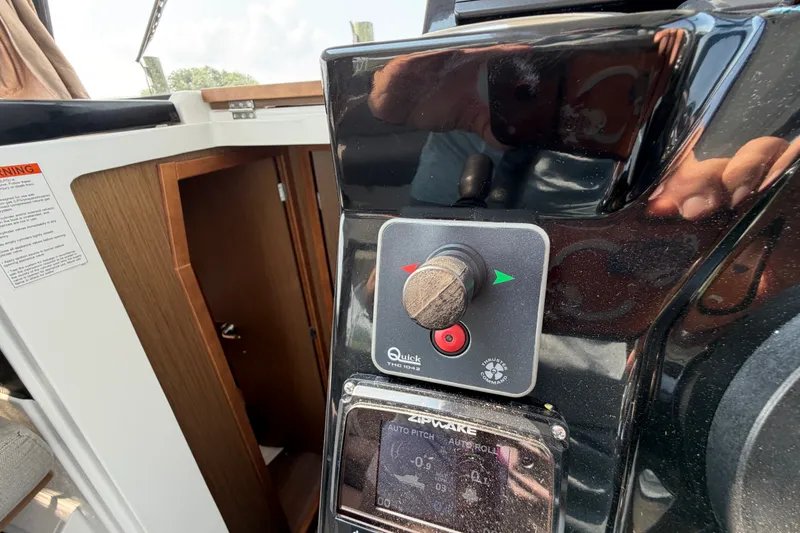 Slide: The Image of Control panel on a 2020 Jeanneau NC Sport 895 boat, featuring Quick and Zipwake systems. - 63