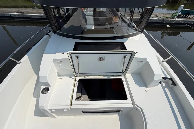 Slide: The Image of 2020 Jeanneau NC Sport 895 boat deck with open storage compartment. - 46