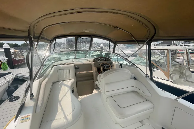 Slide: The Image of Interior view of a 2000 Sea Ray 270 Sundancer boat with seating and helm. - 5
