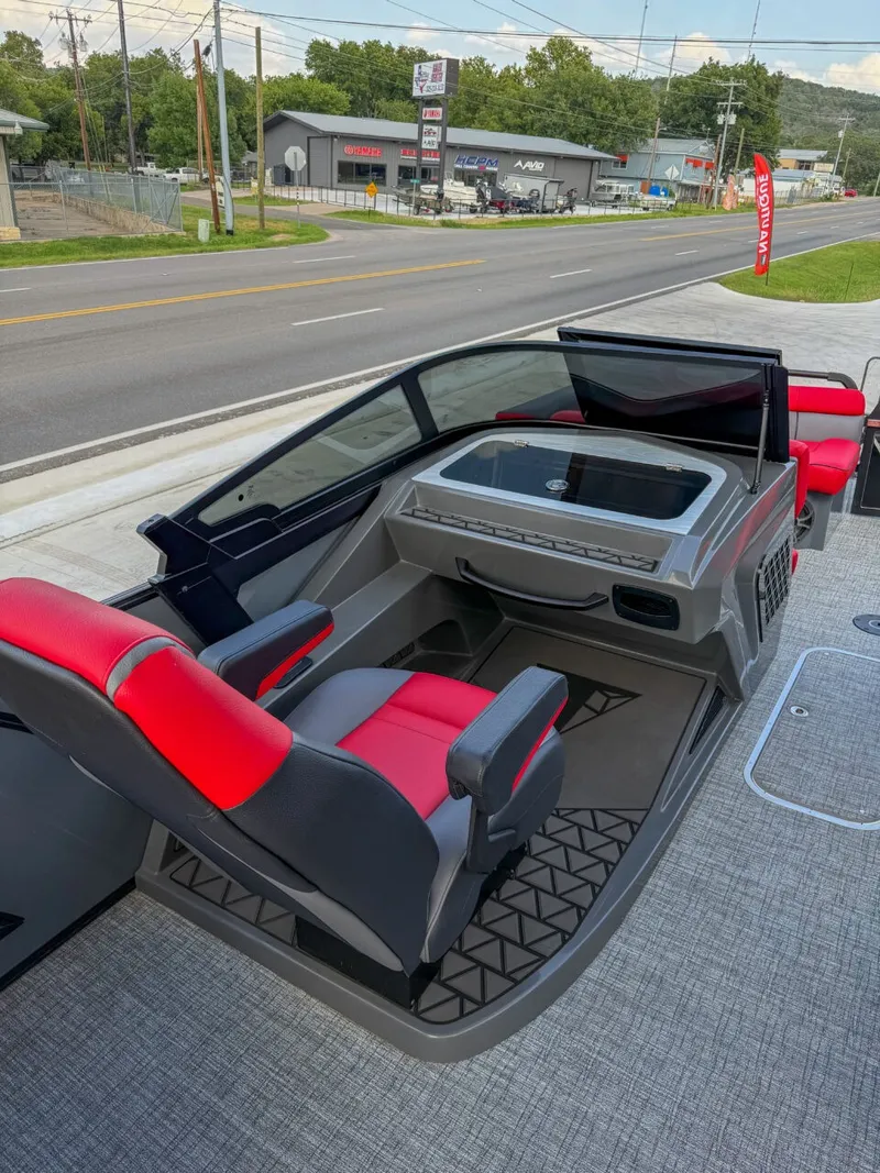 Slide: The Image of The image shows the cockpit of a 2025 Trifecta 25 SPORT RF9 DC 3.0 ARCH boat with red and black seats. - 10