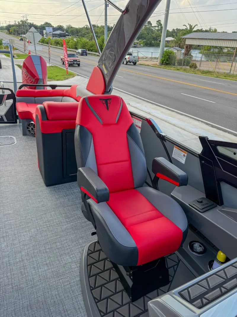 Slide: The Image of A modern boat with red and gray seats, sleek design, and a padded helm station. - 12