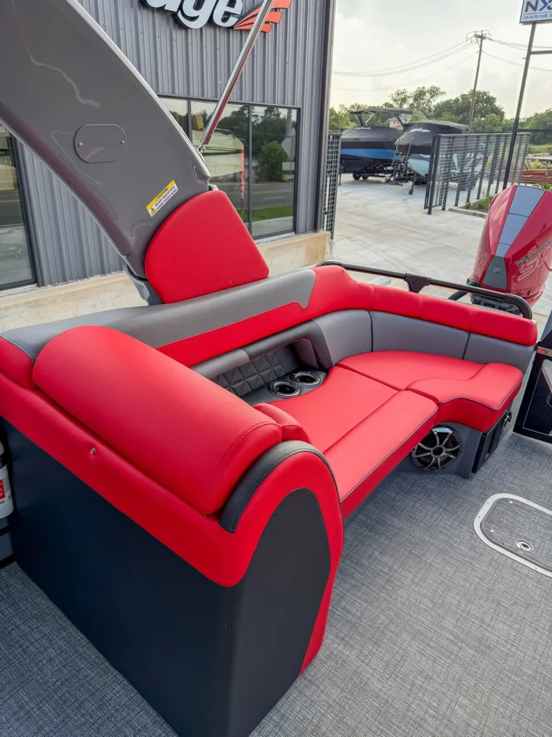 Slide: The Image of The image shows a luxurious red and gray seating area on a modern boat. - 14