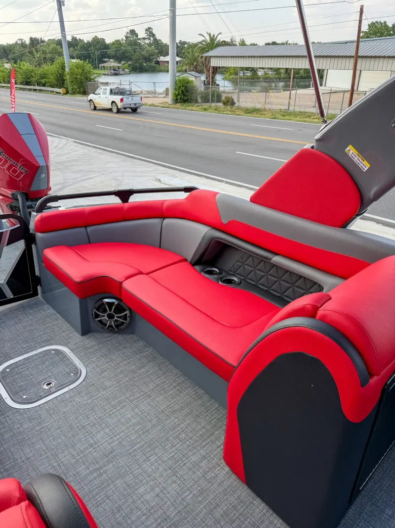 Slide: The Image of The image shows the interior of a 2025 Trifecta 25 SPORT RF9 DC 3.0 ARCH boat with red and gray seating. - 15