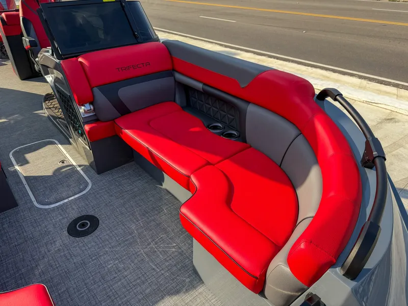 Slide: The Image of The image shows a luxurious boat seat with red and gray upholstery. - 25