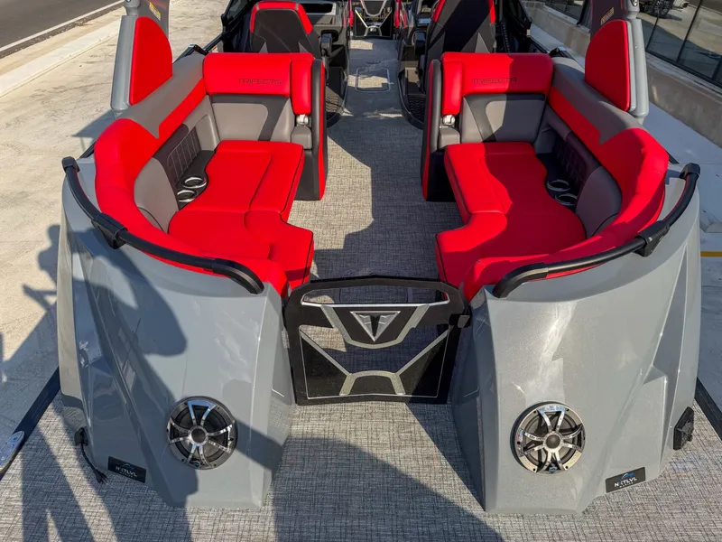 Slide: The Image of The image shows the interior of a 2025 Trifecta 25 SPORT RF9 DC 3.0 ARCH boat with red seating. - 21