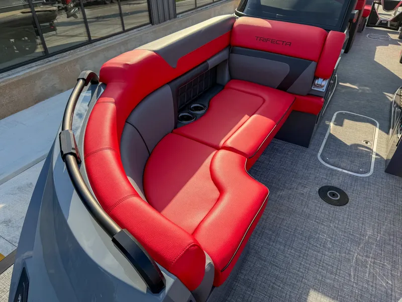 Slide: The Image of The image shows a luxurious red seating area on a modern boat with gray flooring. - 24