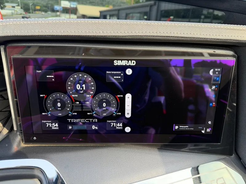 Slide: The Image of The image shows a modern Simrad display on a boat, displaying navigation and performance data. - 20