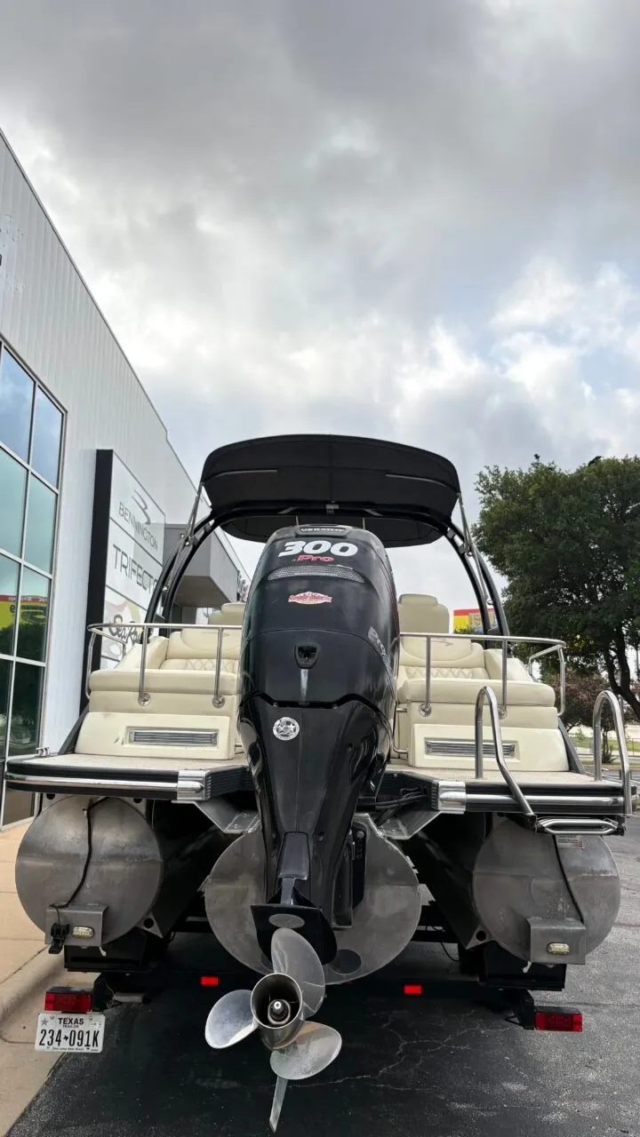 Slide: The Image of The image shows a 2015 Bennington 2575 QCW pontoon boat with a large outboard motor. - 8