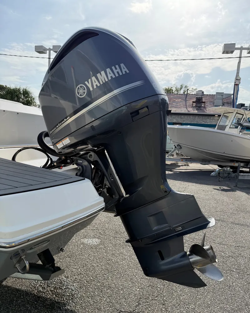 Slide: The Image of A Yamaha outboard motor is mounted on a Cobia 240 Dual Console boat. - 40