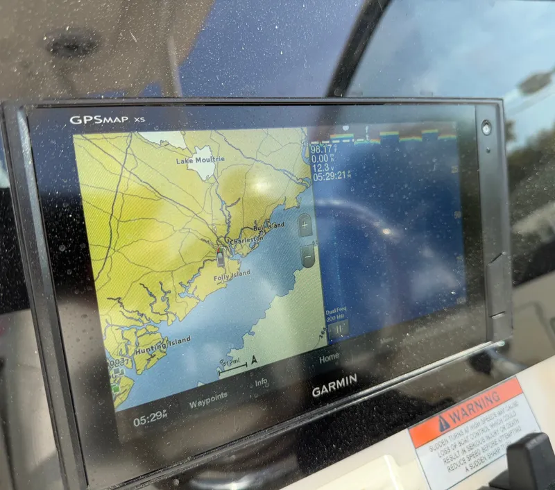 Slide: The Image of A Garmin GPS chartplotter displays a coastal map with various islands and waterways. - 15