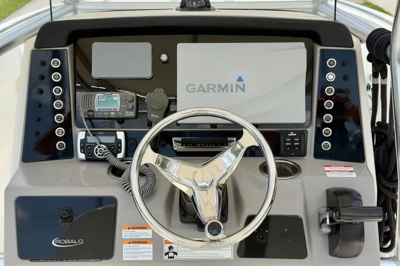 Slide: The Image of 2020 Robalo R230 Center Console dashboard with Garmin display and controls. - 6