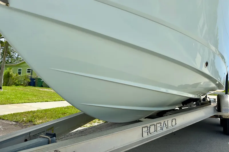 Slide: The Image of 2020 Robalo R230 Center Console boat on trailer, side view. - 61