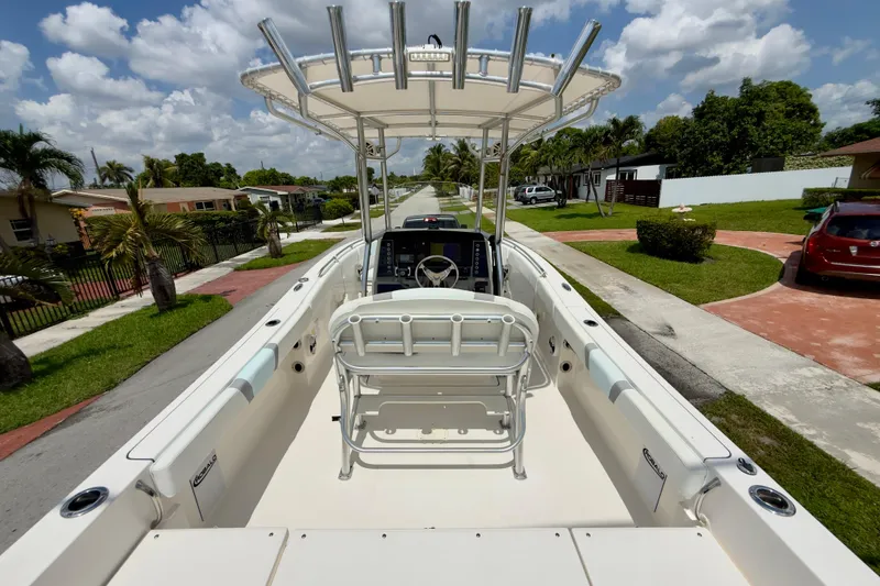 Slide: The Image of 2020 Robalo R230 Center Console boat on a sunny residential street. - 4