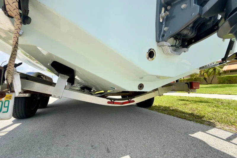 Slide: The Image of 2020 Robalo R230 Center Console boat on trailer, rear view. - 58
