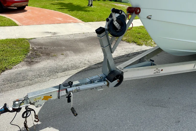 Slide: The Image of Trailer hitch of 2020 Robalo R230 Center Console boat on pavement. - 64