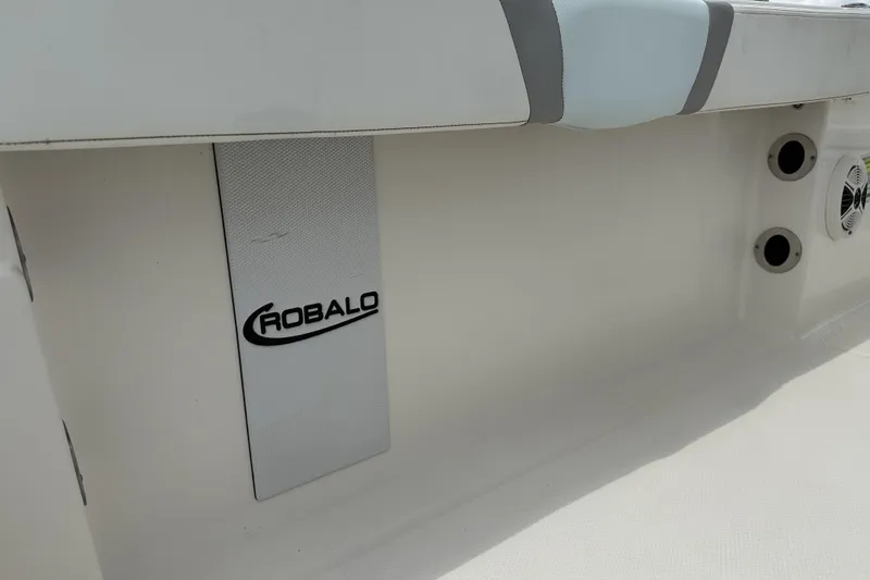 Slide: The Image of 2020 Robalo R230 Center Console interior detail with logo and speaker. - 27