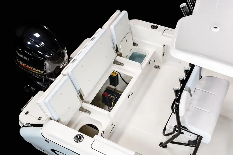Slide: The Image of Manufacturer Provided Image: 2020 Robalo R230 Center Console boat with open storage compartments and Yamaha outboard motor. - 76