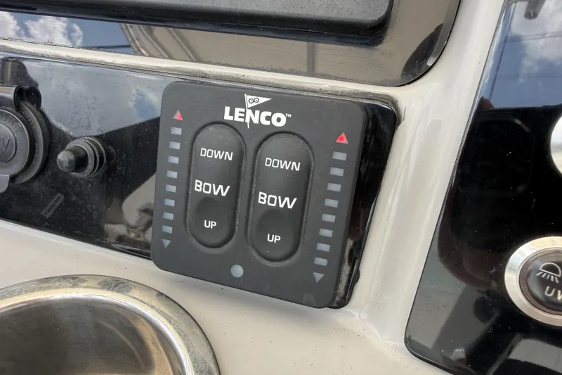 Slide: The Image of Lenco trim tab control panel on 2020 Robalo R230 Center Console boat. - 11