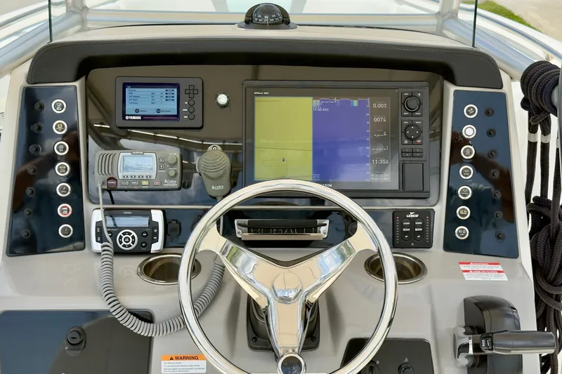 Slide: The Image of 2020 Robalo R230 Center Console dashboard with advanced navigation and control systems. - 7